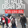 Koltuk değnekleriyle dışarıya çıkan yaşlı adam