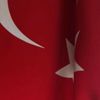 İşyerinin önündeki Türk bayrakları yakıldı İşyerinin önündeki Türk bayrakları yakıldı