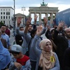 Almanya'da protestolarla karşılandı Almanya'da protestolarla karşılandı