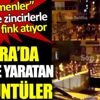 ﻿Göçmenler ellerinde zincirlerle sokakta fink atıyor