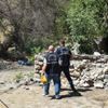 Çıkardığı yangında söndürme çalışmalarını izlerken yakalandı Çıkardığı yangında söndürme çalışmalarını izlerken yakalandı