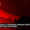 ARAÇLA ASFALT ARASINDA SIKIŞAN SÜRÜCÜYÜ İTFAİYE EKİPLERİ ...