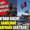 ﻿Taliban’dan kaçıp Alanya’da plajda göndere Afgan bayrağı çektiler