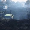 İzmir'de otluk alanda çıkan yangın, yediemin otoparkındaki araçlara sıçradı