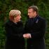 Macron ve Merkel'den sembolik görüşme Macron ve Merkel'den sembolik görüşme