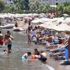 Marmaris'te sıcaktan bunalanlar plajları doldurdu
