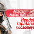 Asker, kendisini ölümden kurtaran miğferiyle nöbette