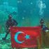 AKP'li Günay su altında Türk bayrağı açtı AKP'li Günay su altında Türk bayrağı açtı