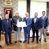 Sarnıç Han da tapular verildi Sarnıç Han da tapular verildi